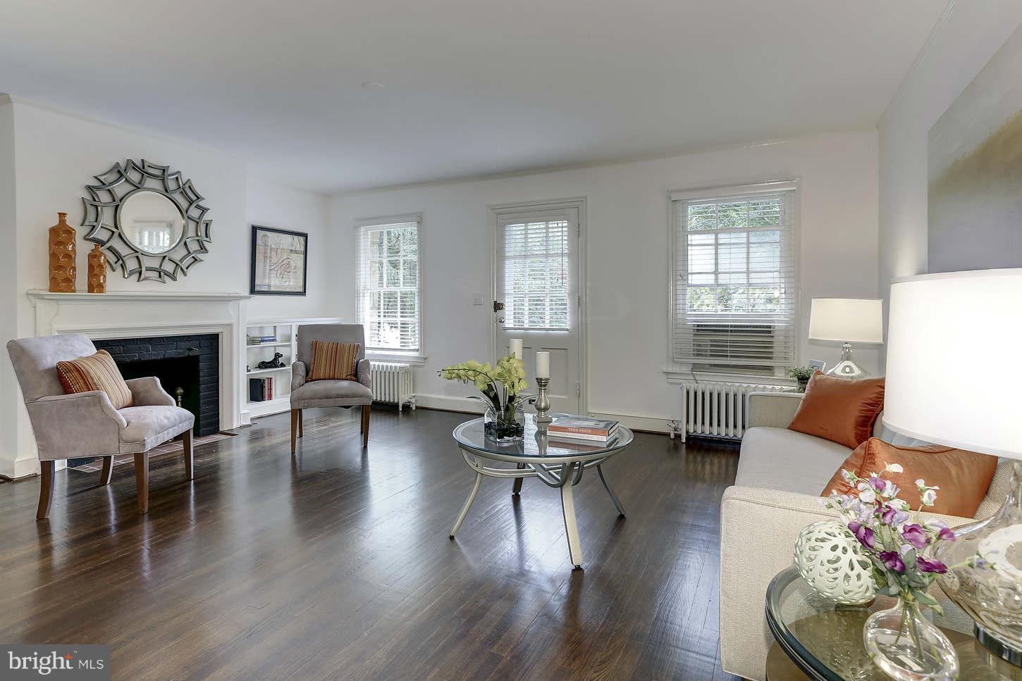 3707 Reservoir Road Northwest Washington, DC 20007 - Photo 4 of 19 a living room with fireplace furniture and a wooden floor