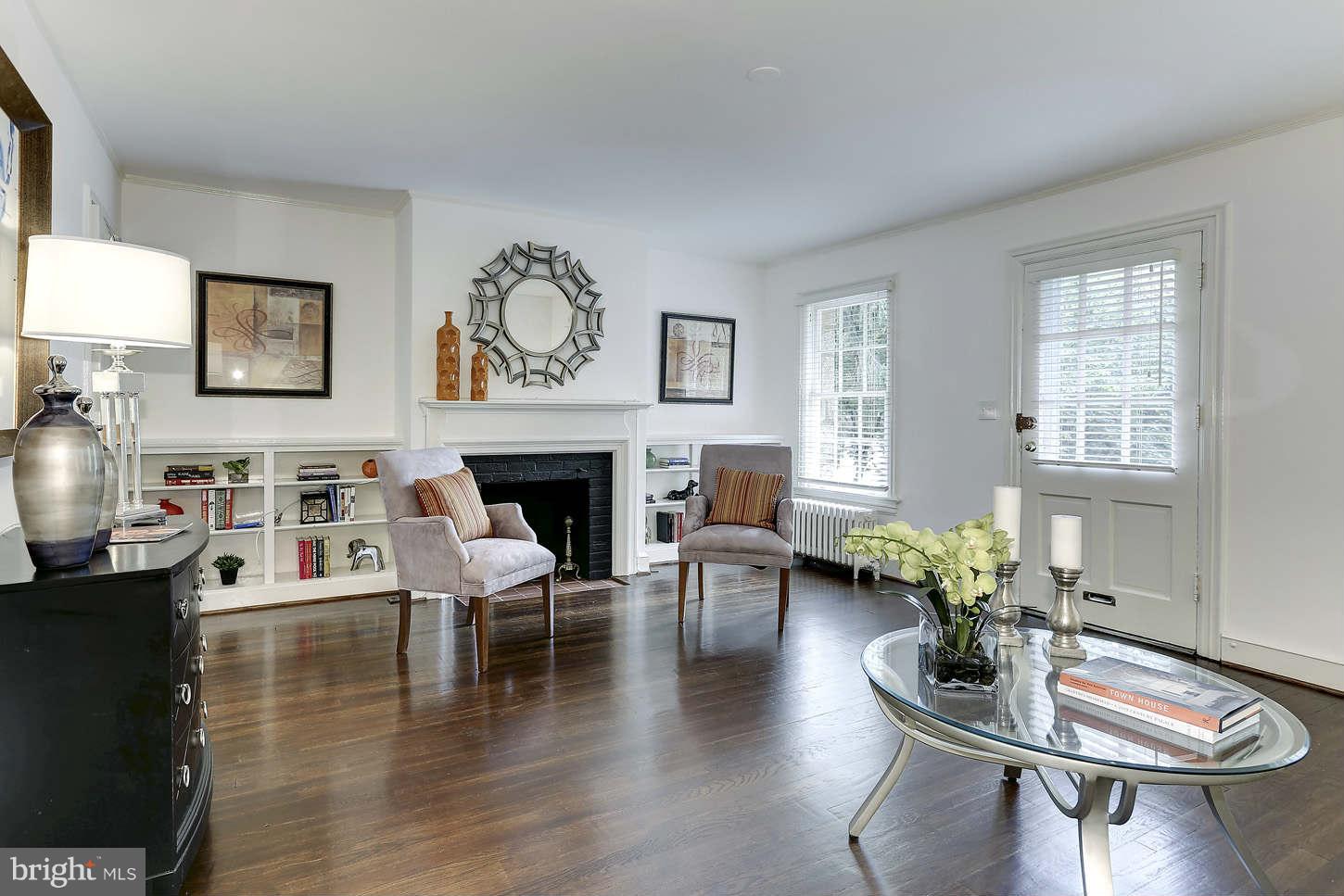 3707 Reservoir Road Northwest Washington, DC 20007 - Photo 5 of 19 a living room with fireplace furniture and a wooden floor