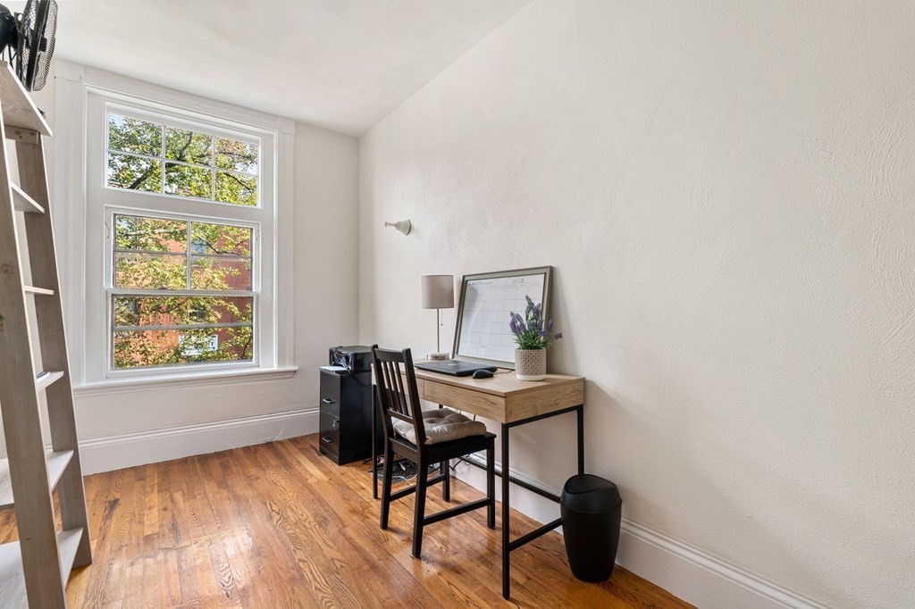 18 Symphony Road Boston, MA 02115 - Photo 19 of 34 a view of a workspace with furniture and a window