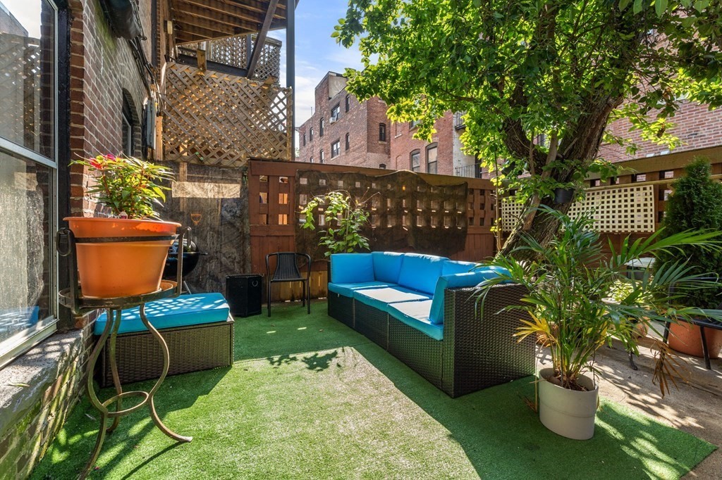 18 Symphony Road Boston, MA 02115 - Photo 25 of 34 a view of a chair and table in backyard