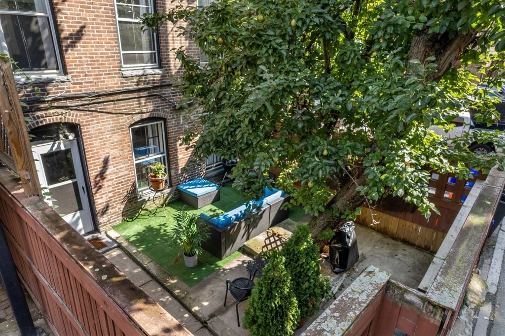 18 Symphony Road Boston, MA 02115 - Photo 28 of 34 a backyard of a house with lots of green space