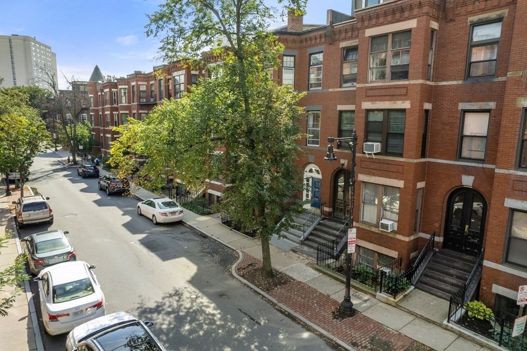 18 Symphony Road Boston, MA 02115 - Photo 29 of 34 a view of a patio with couches table and chairs and potted plants