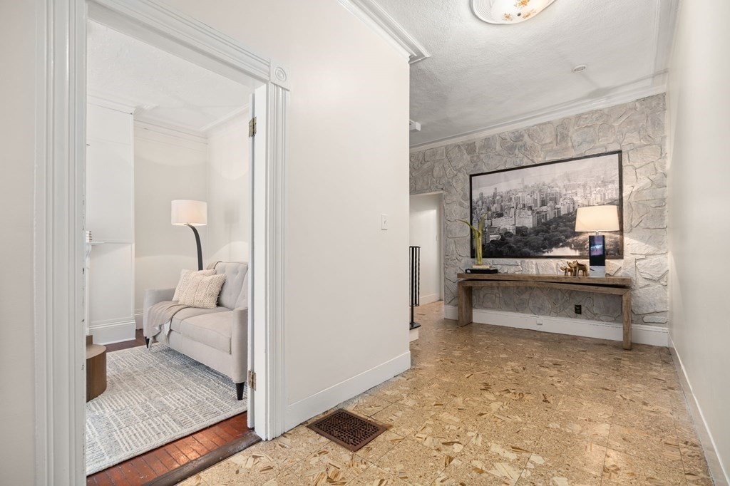 18 Symphony Road Boston, MA 02115 - Photo 3 of 34 a living room with furniture and a large window