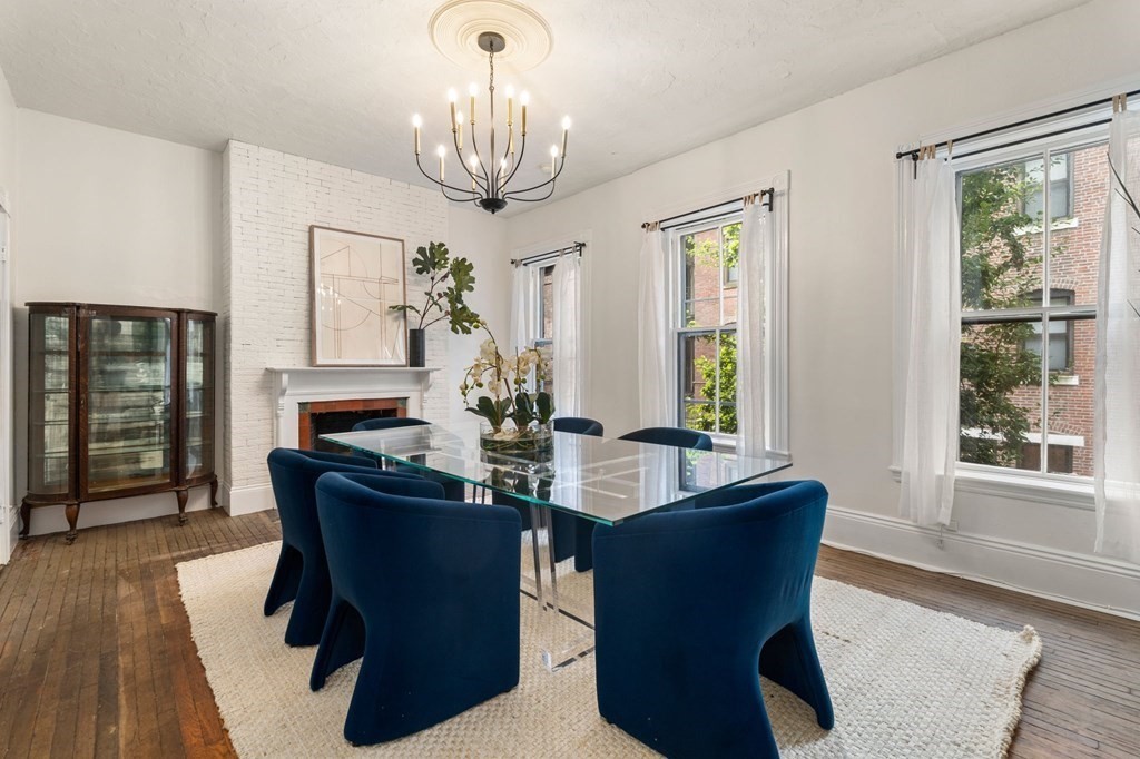 18 Symphony Road Boston, MA 02115 - Photo 9 of 34 a view of a dining room with furniture window and wooden floor