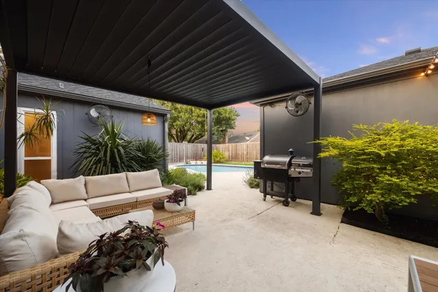 a outdoor living space with furniture and a potted plant