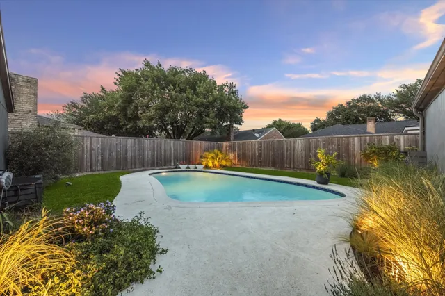 a view of a back yard with a slide of the house