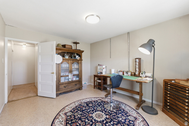 365 North Main Street Fillmore, UT 84631 - Photo 48 of 51 Neutral-toned room featuring a white paneled door, light-colored walls, and a recessed closet with an overhead light fixture
