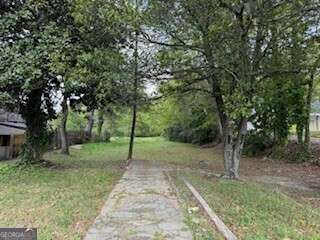 0 Spring Street Warm Springs, GA 31830 - Photo 5 of 10 a view of a park with large trees