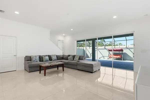 a kitchen with granite countertop a sink a center island a stove and a window