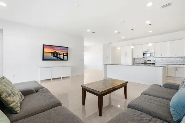 a living room with furniture and a window