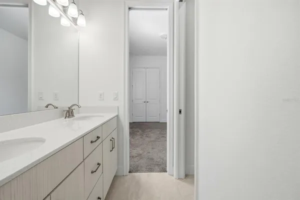 an aerial view of a house with swimming pool and a yard