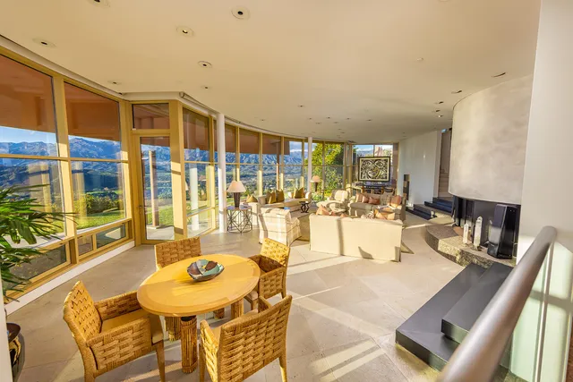 a kitchen with stainless steel appliances granite countertop a refrigerator a stove and a sink