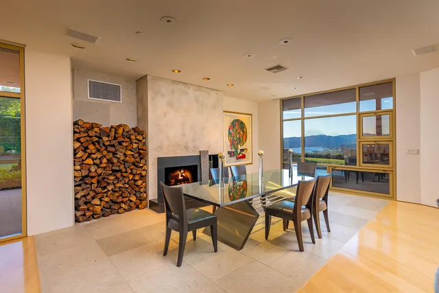 a kitchen with a refrigerator and a stove top oven