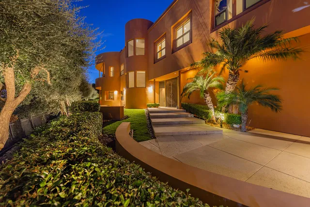 a view of a swimming pool with an outdoor seating and a yard