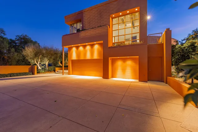 an outdoor space with furniture and garden
