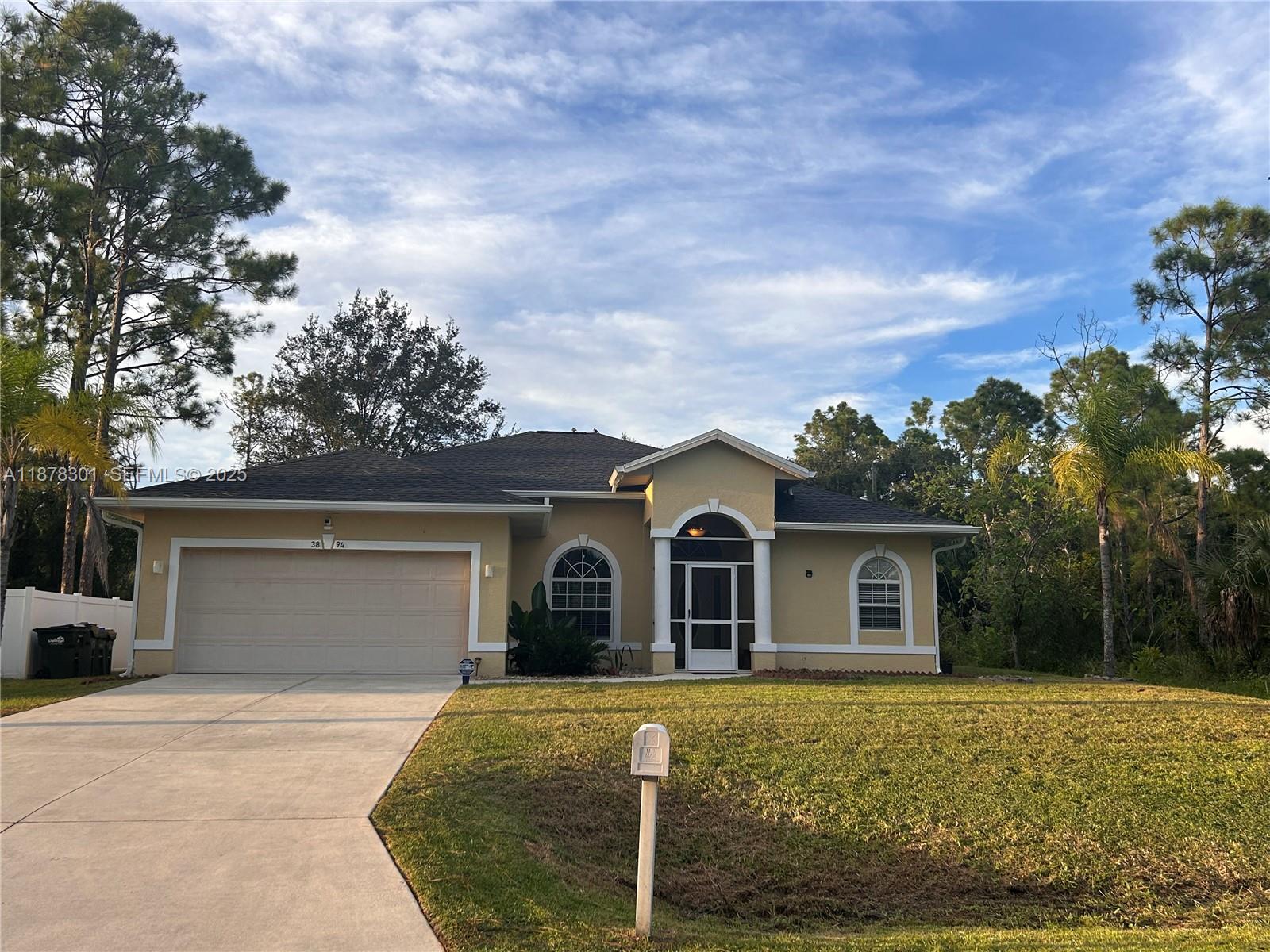 a front view of a house with garden
