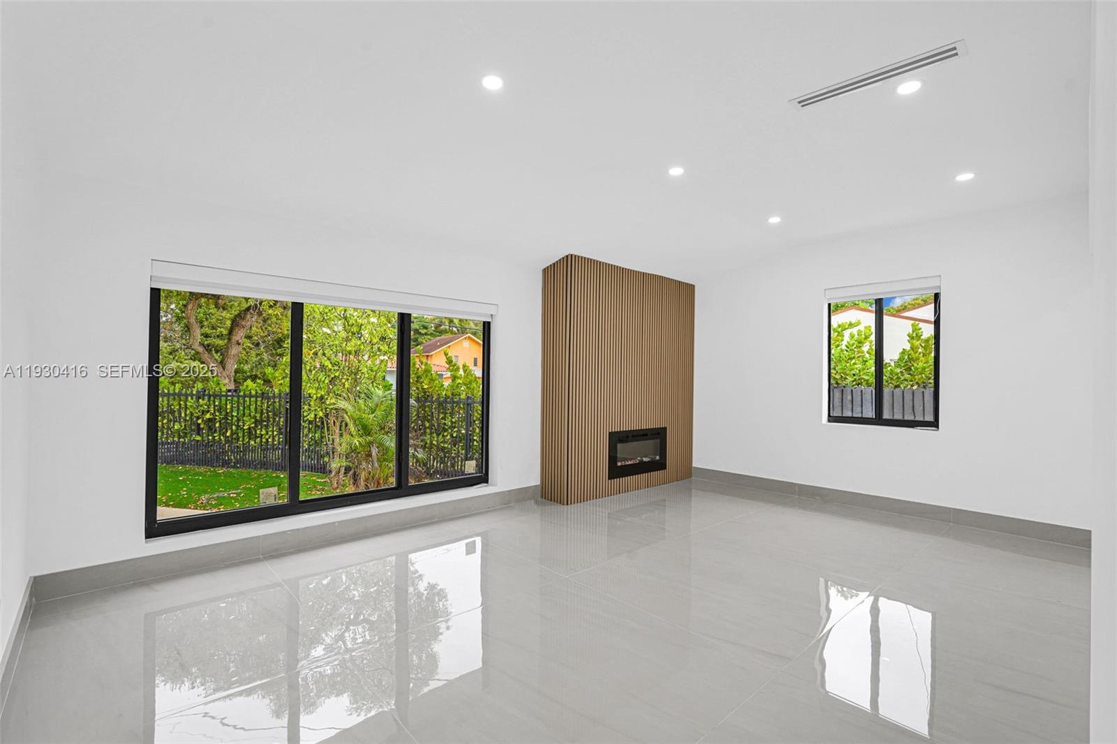 998 Southwest 11th Street Miami, FL 33129 - Photo 17 of 66 a view of an empty room with a window