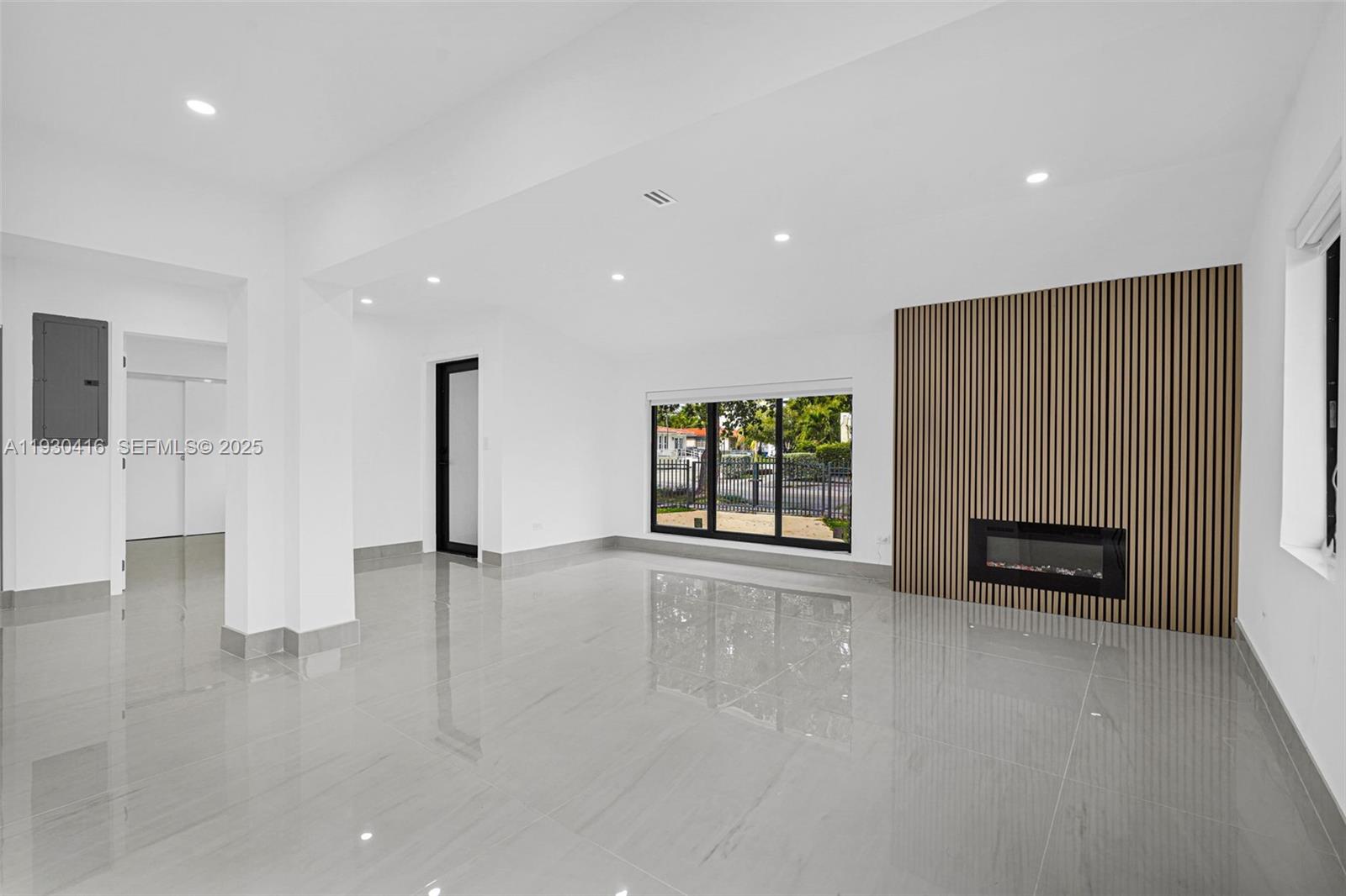 998 Southwest 11th Street Miami, FL 33129 - Photo 21 of 66 a view of an empty room with a fireplace and window