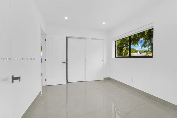 a bathroom with a shower toilet and sink