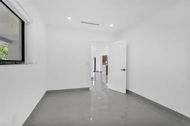 a view of hallway with a large window