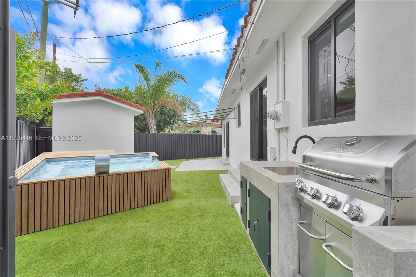 998 Southwest 11th Street Miami, FL 33129 - Photo 3 of 66 a view of a house with a tub and fire pit