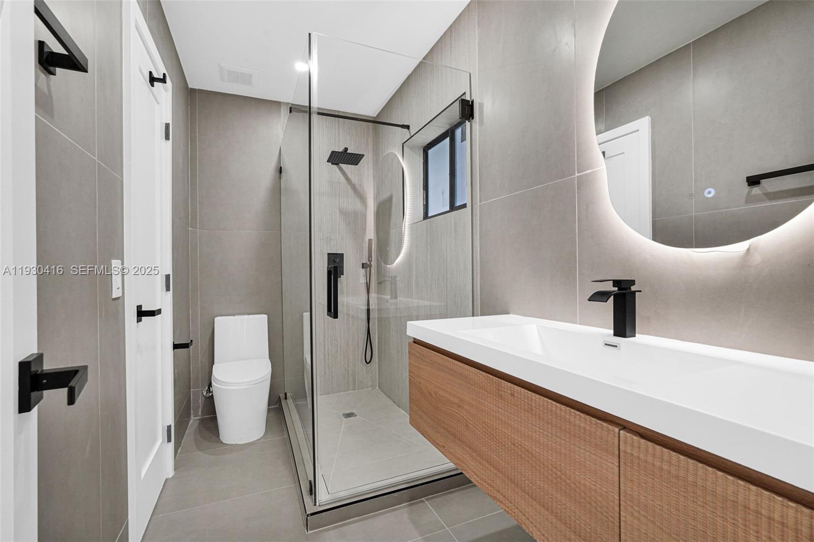 998 Southwest 11th Street Miami, FL 33129 - Photo 34 of 66 a bathroom with a sink a toilet and shower