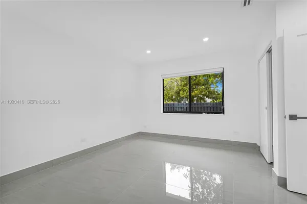 a view of a backyard with sitting area