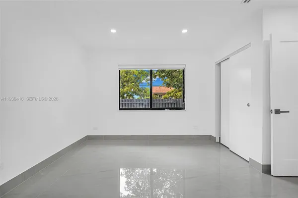 a kitchen with stainless steel appliances a refrigerator and a stove top oven