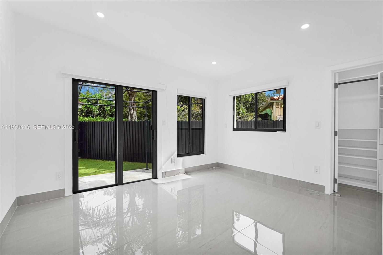 998 Southwest 11th Street Miami, FL 33129 - Photo 49 of 66 a view of an empty room with glass door