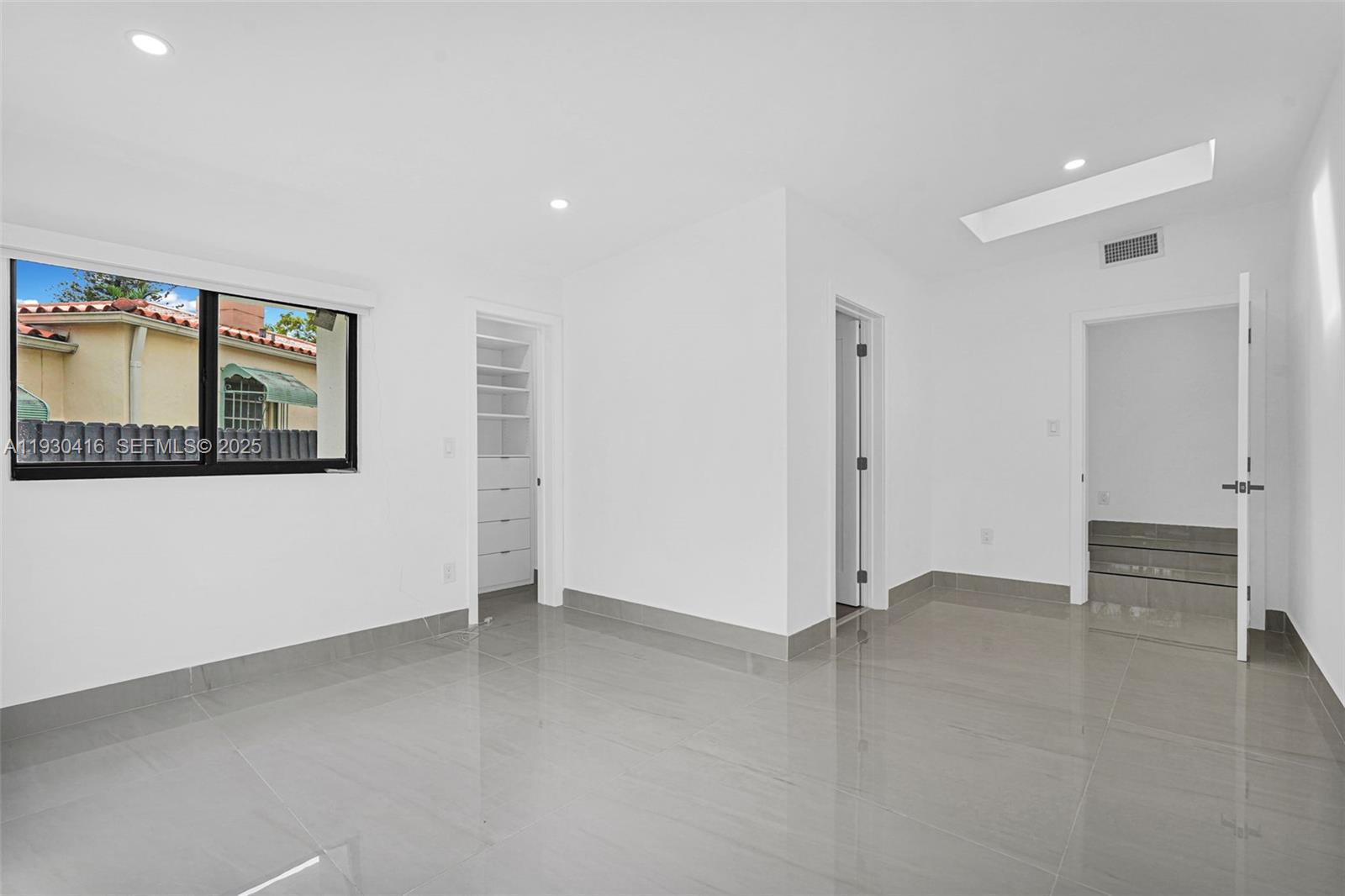 998 Southwest 11th Street Miami, FL 33129 - Photo 50 of 66 an empty room with windows and closet