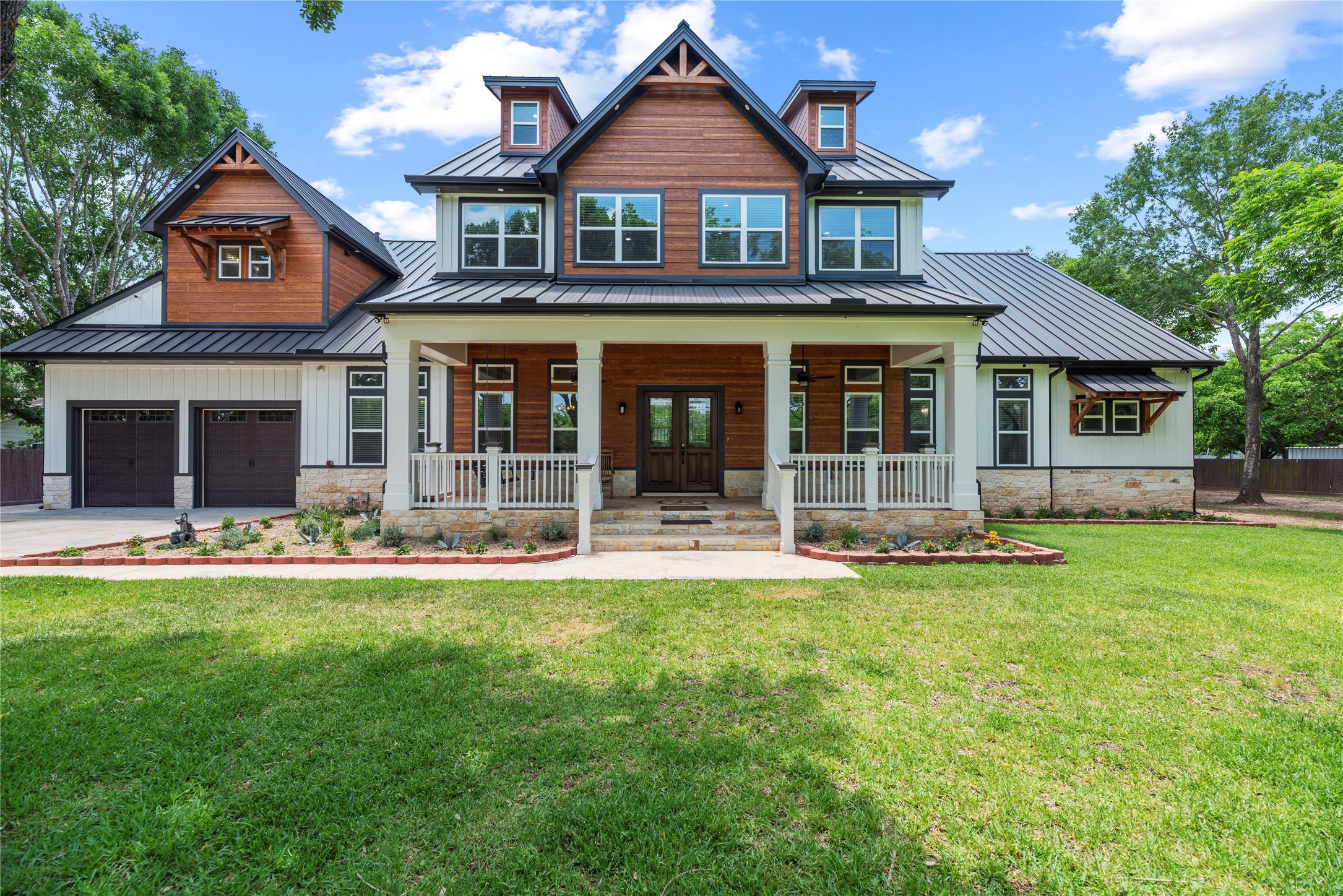 A striking modern farmhouse masterpiece showcasing impeccable craftsmanship, designer finishes, and exceptional curb appeal.