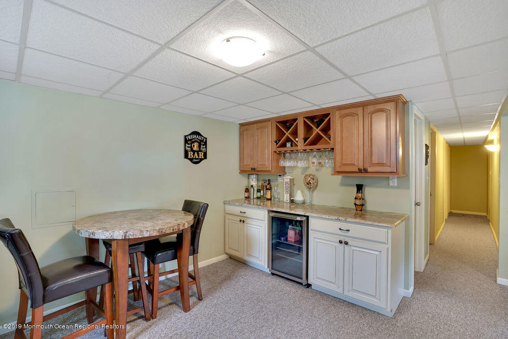 3 Hemlock Road Howell, NJ 07731 - Photo 24 of 36 a view of a kitchen from a dining room