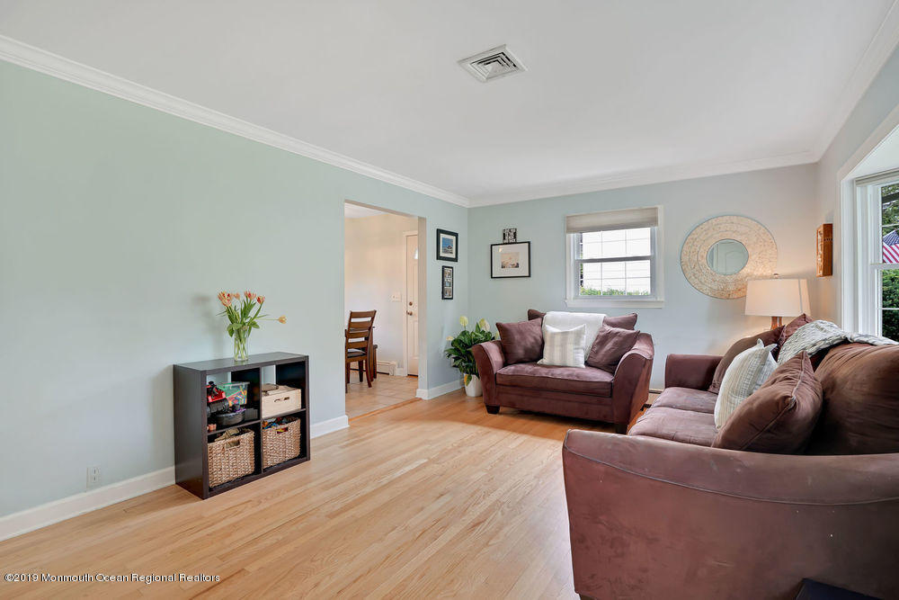 3 Hemlock Road Howell, NJ 07731 - Photo 8 of 36 a living room with furniture and wooden floor