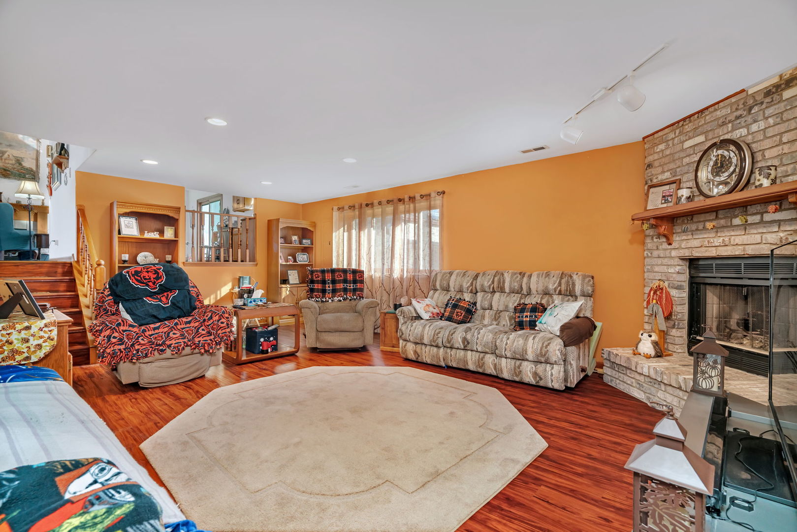 20107 Arroyo Avenue Lynwood, IL 60411 - Photo 16 of 33 a living room with furniture and a fireplace