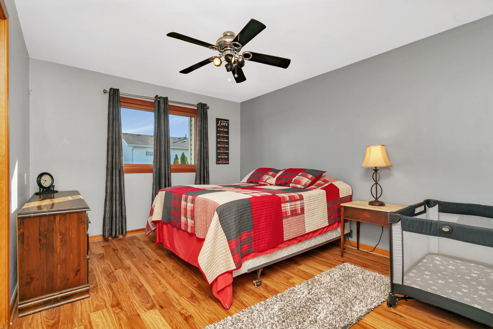 20107 Arroyo Avenue Lynwood, IL 60411 - Photo 19 of 33 a bedroom with a bed and wooden floor