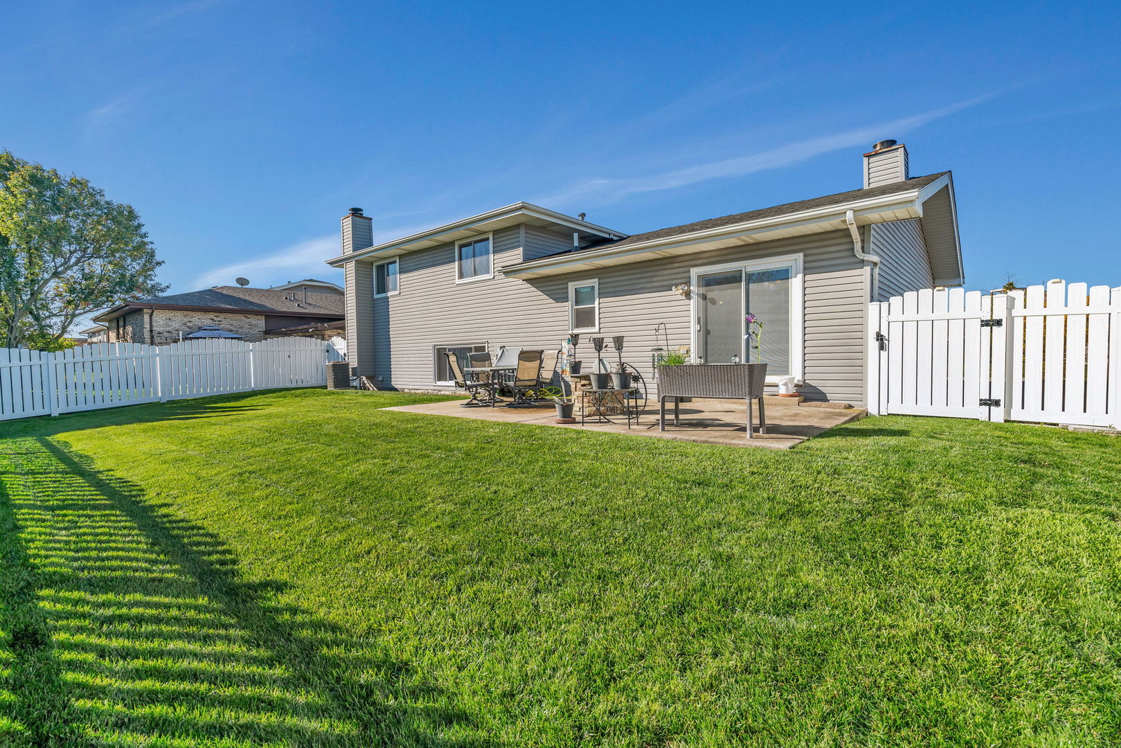 20107 Arroyo Avenue Lynwood, IL 60411 - Photo 27 of 33 a front view of house with yard and seating area