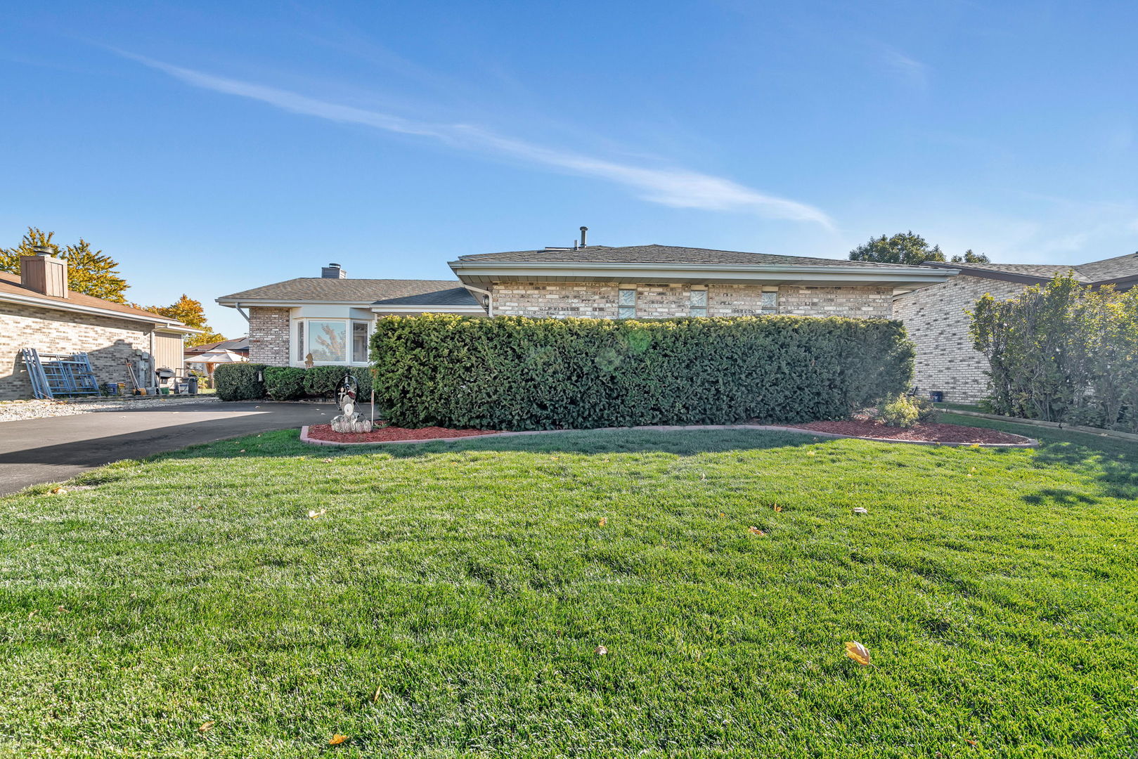 20107 Arroyo Avenue Lynwood, IL 60411 - Photo 29 of 33 a front view of a house with a yard and outdoor seating
