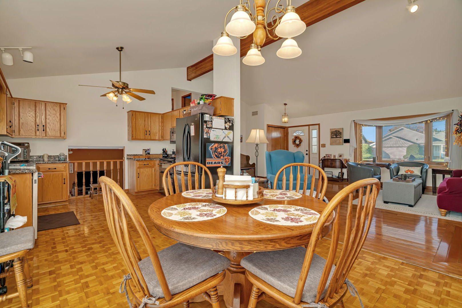 20107 Arroyo Avenue Lynwood, IL 60411 - Photo 7 of 33 a view of a dining room with furniture a chandelier and wooden floor