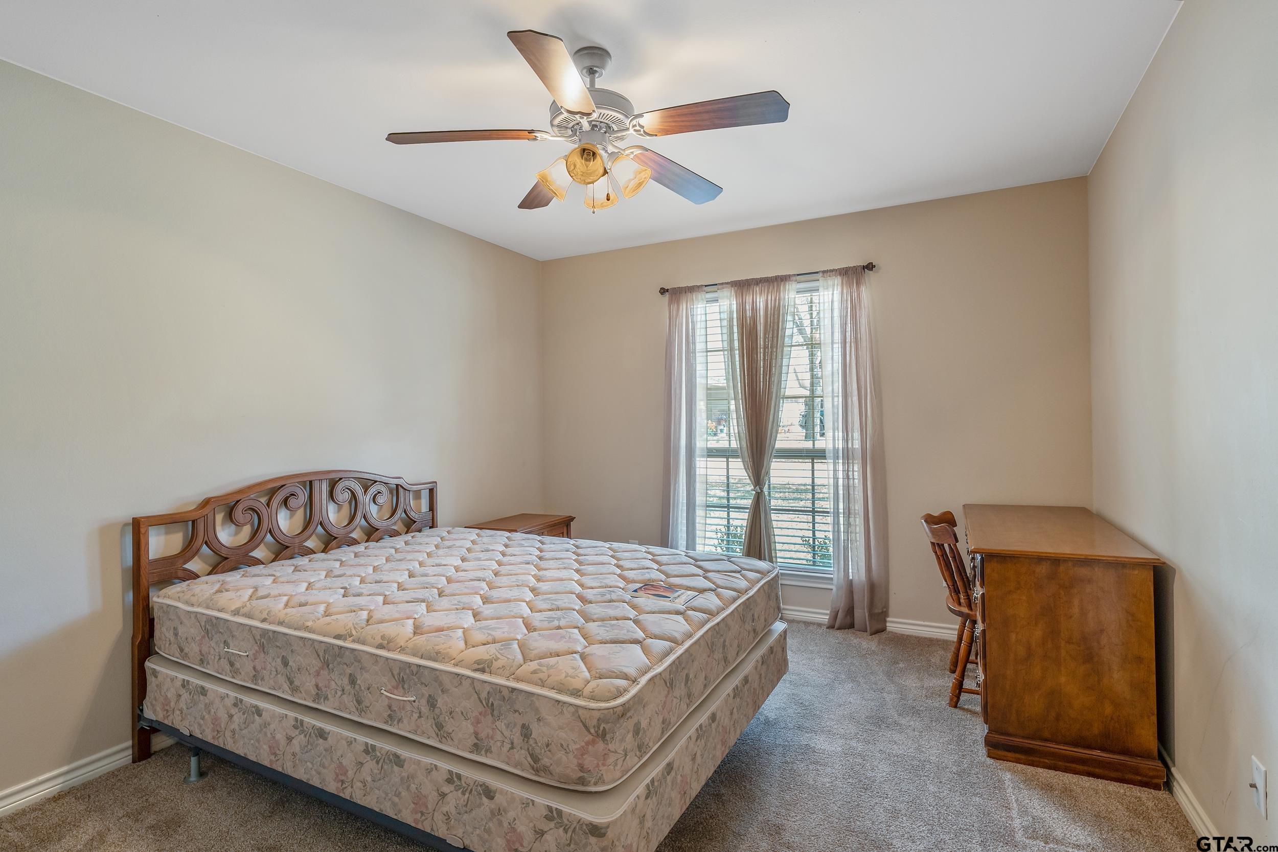 421 West Cumberland Road, Unit 205 Tyler, TX 75703 - Photo 11 of 24 a bedroom with a bed and window