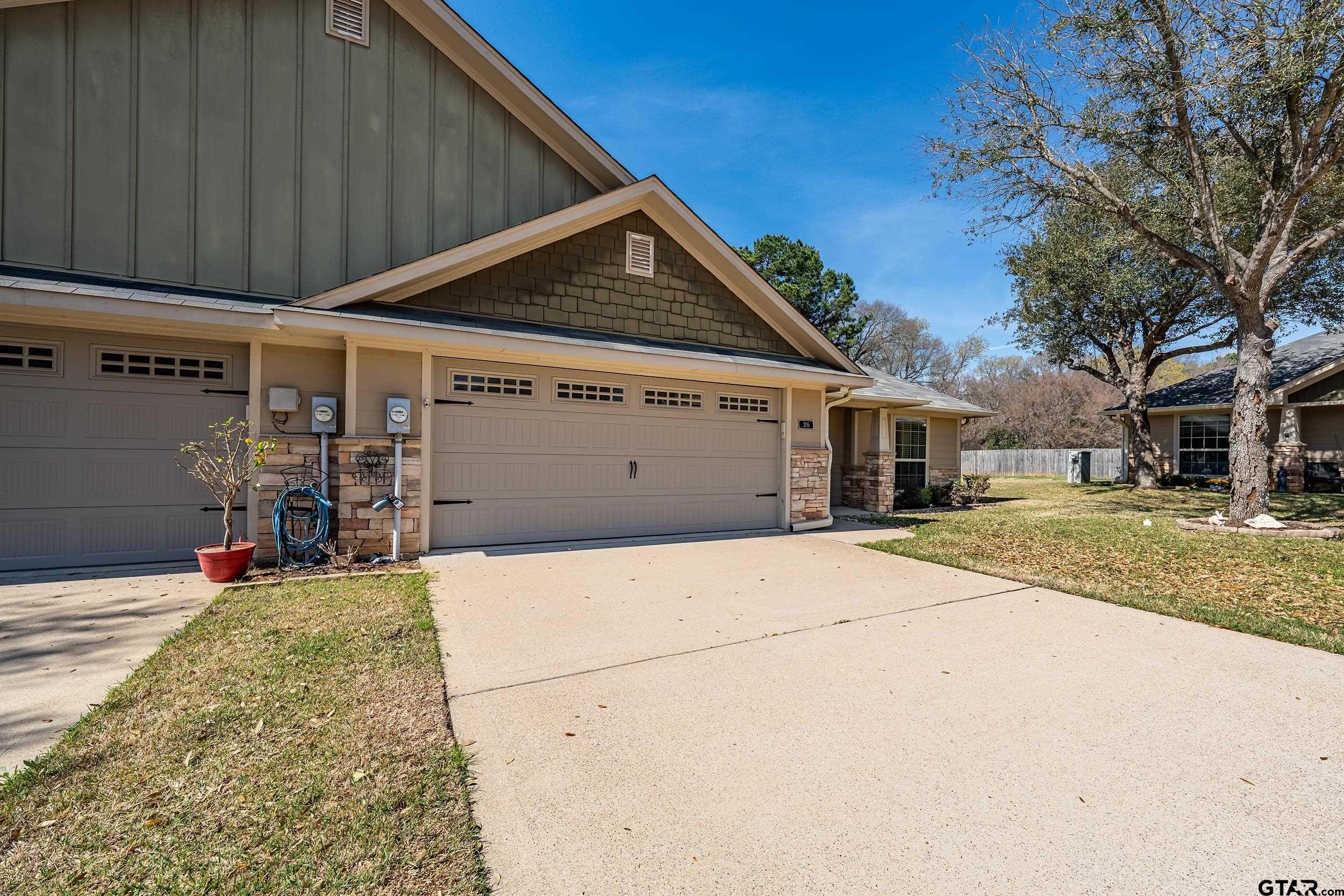 421 West Cumberland Road, Unit 205 Tyler, TX 75703 - Photo 15 of 24 a view of a house with a garage