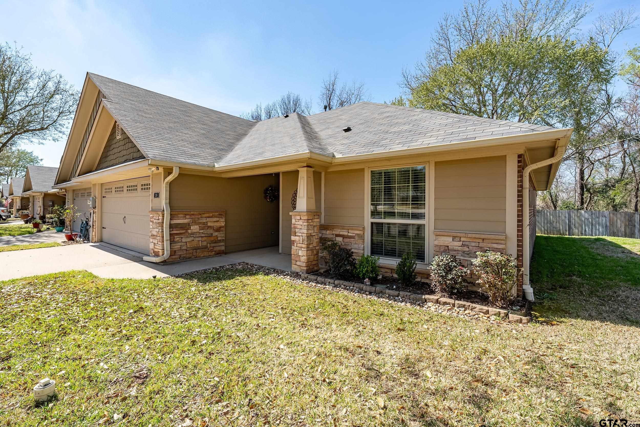 421 West Cumberland Road, Unit 205 Tyler, TX 75703 - Photo 16 of 24 a view of a house with backyard and garden