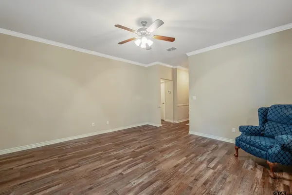 a view of livingroom with hardwood floor and ceiling fan