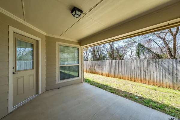 a view of yellow house with a yard