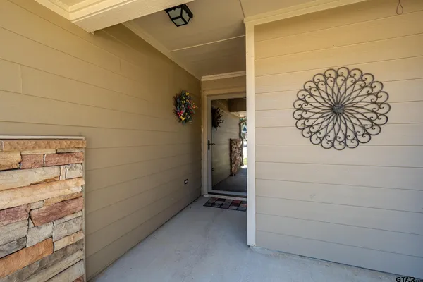 a view of bathroom with a sink and a mirror