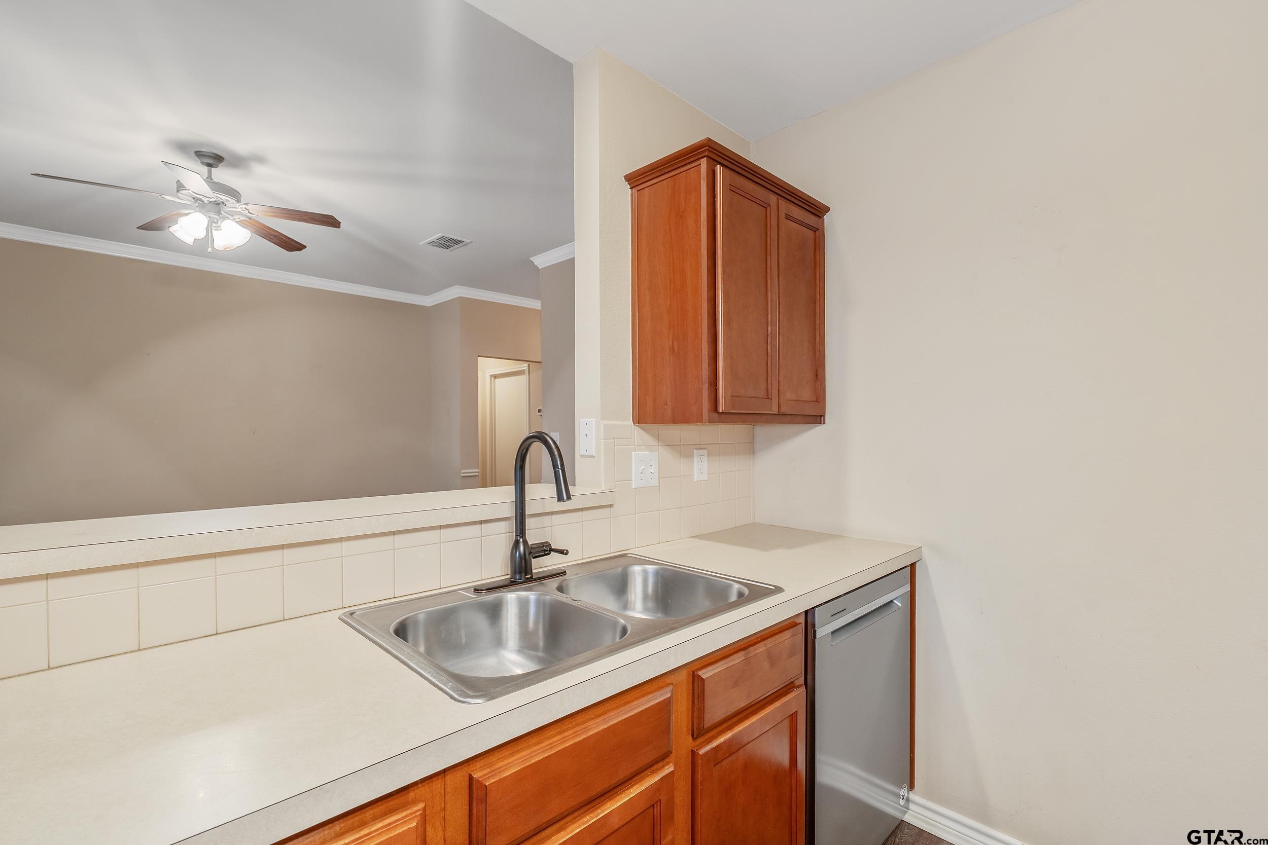 421 West Cumberland Road, Unit 205 Tyler, TX 75703 - Photo 6 of 24 a bathroom with a sink and a mirror