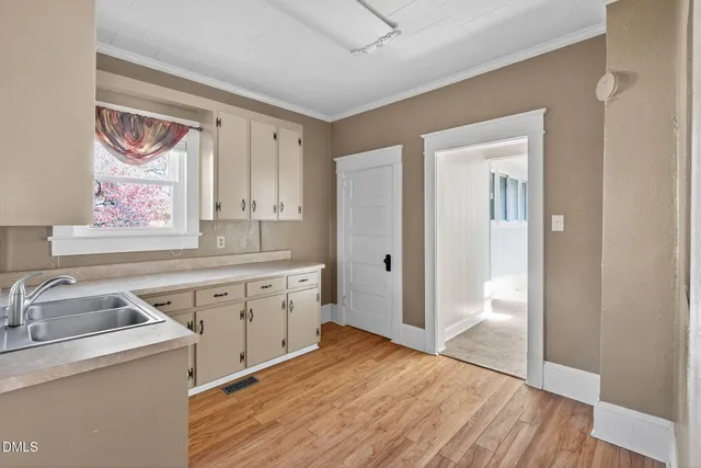 a spacious bathroom with a granite countertop sink mirror and a