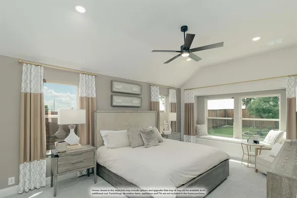 a bedroom with a large bed and a large window