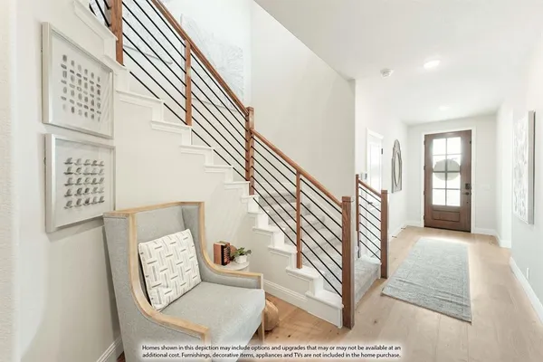 a living room with furniture a fireplace and a kitchen view