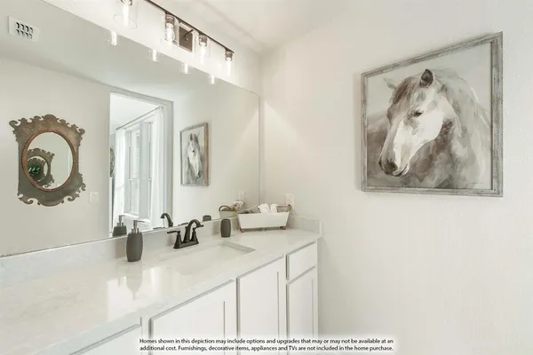 a bathroom with a sink vanity and a mirror
