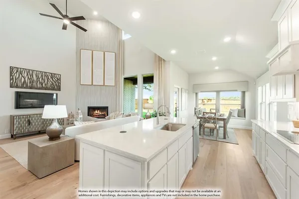 a kitchen with a sink a stove and cabinets